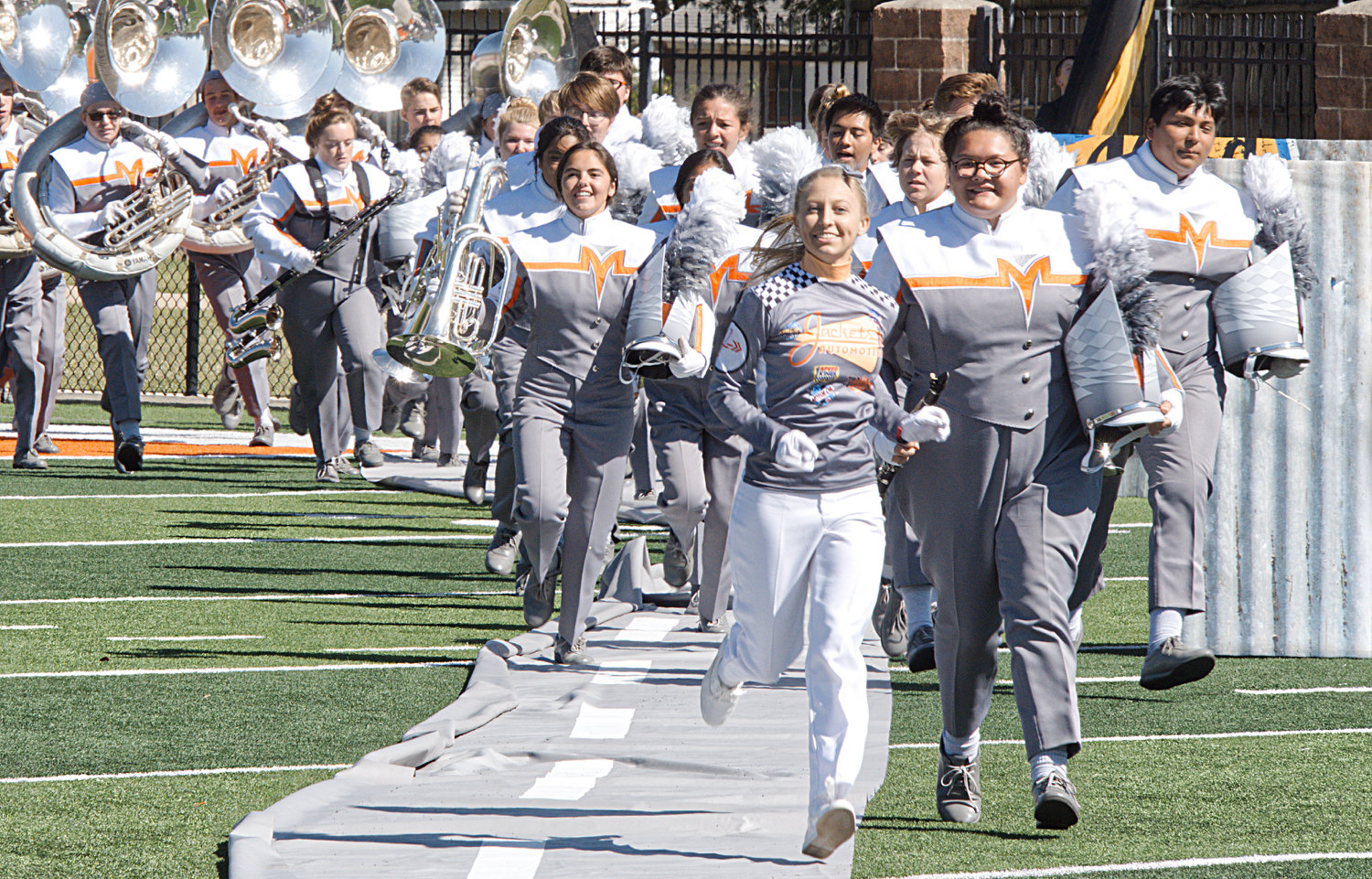 The Sound of the Swarm Mineola High School marching band is led onto the field by drum major Tristan Kirk on Tuesday at the Region 4 marching contest in Texarkana.